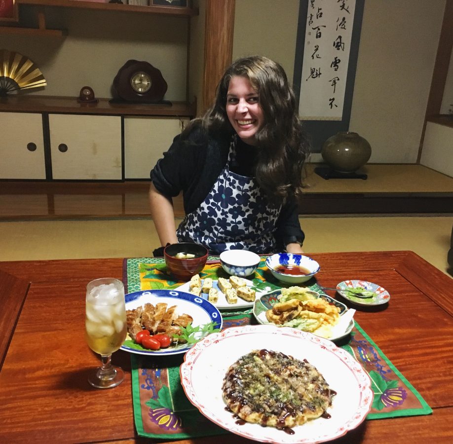 Girl posing with a meal in Asia while traveling alone.