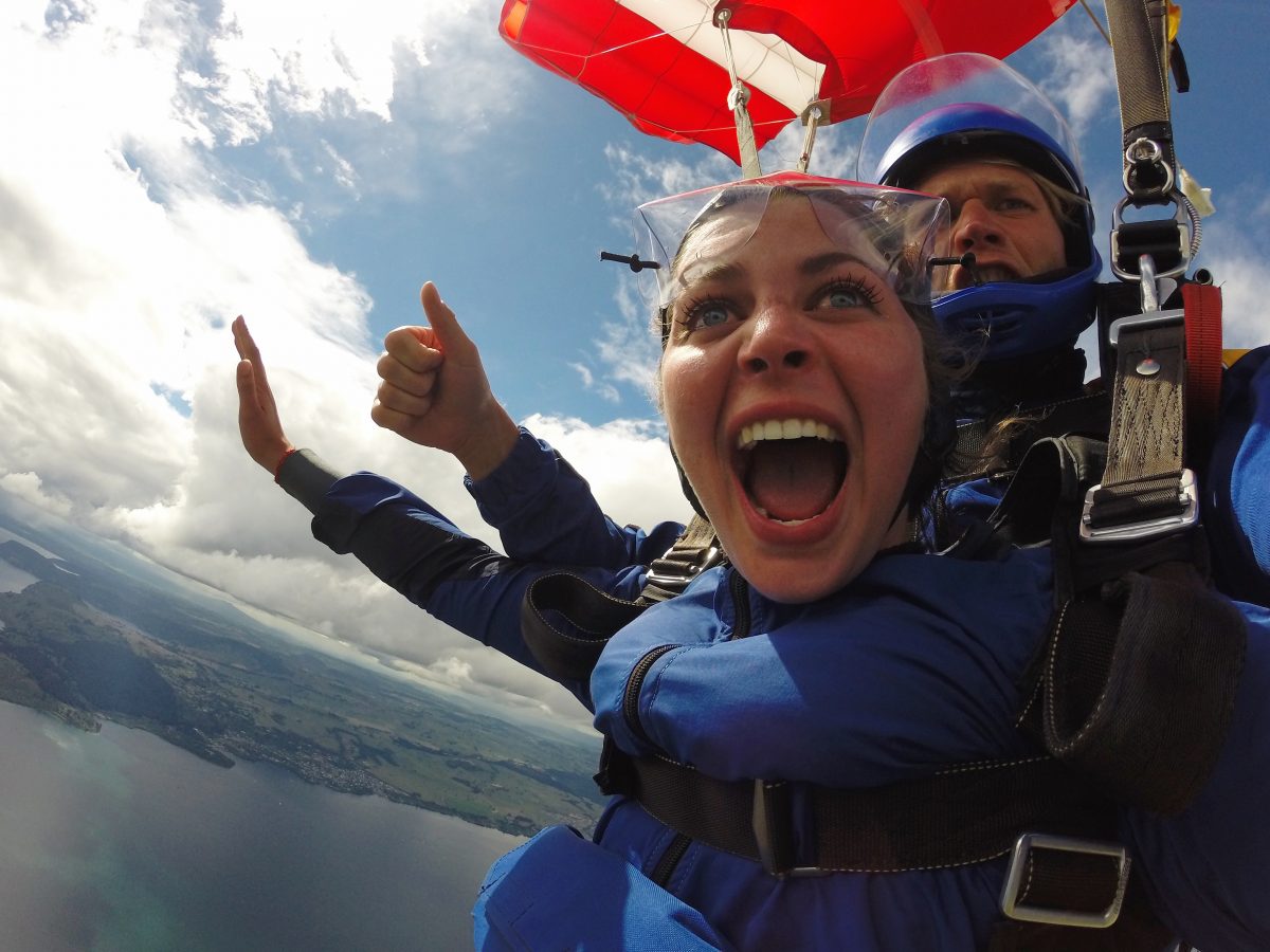 Girl skydiving during a solo travel trip.