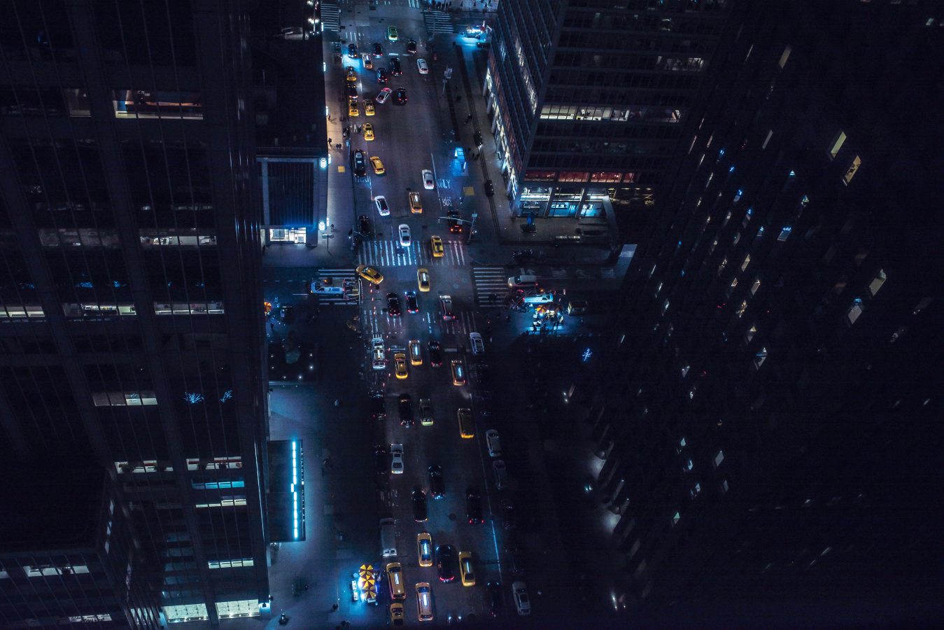 Aerial view of busy New York City street at night.