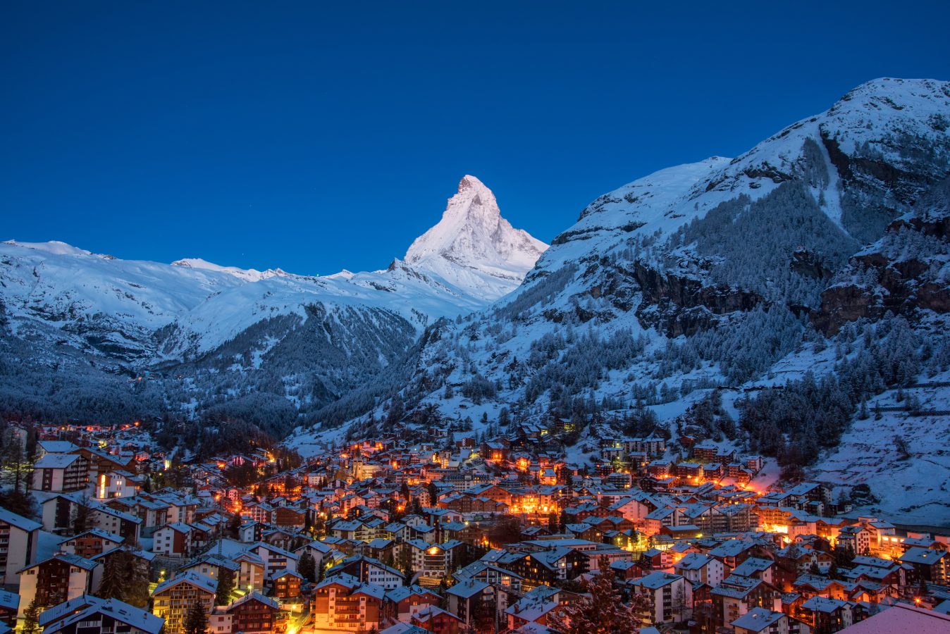 Zermatt city village in the Valley and Matterhorn Peak in the background in Switzerland with snowy winter season.