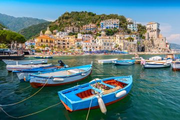 Leisure boats and traditional buildings in Cetara harbor, Amalfi coast, Italy.