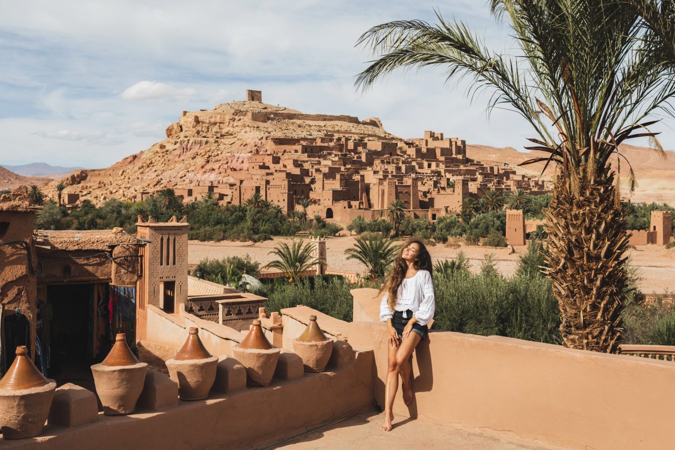Young woman in Morocco. Ait-Ben-Haddou in background.