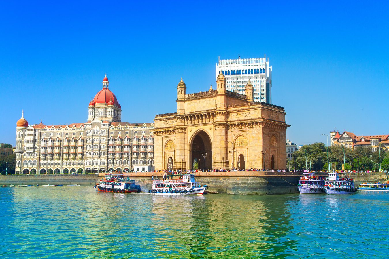 The Gateway of India and boats as seen from the Mumbai Harbour in India.