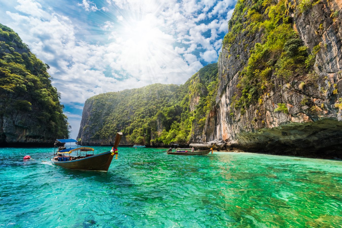 Beautiful landscape with traditional boat on the sea in Phi Phi Lee region of Losama Bay in Thailand.