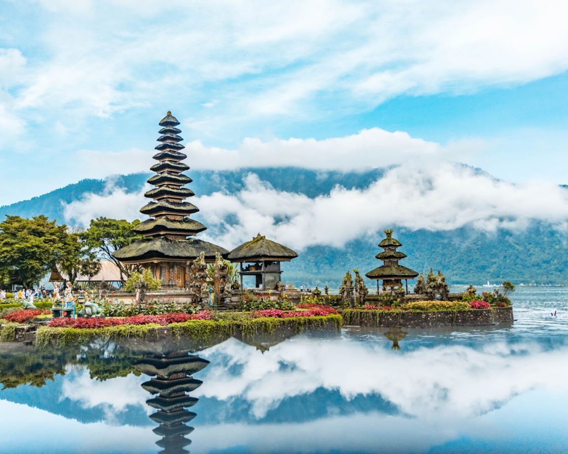 Temple on the waters with a mountain in the background in Bali, Indonesia - the destination to travel to for Journalism majors.