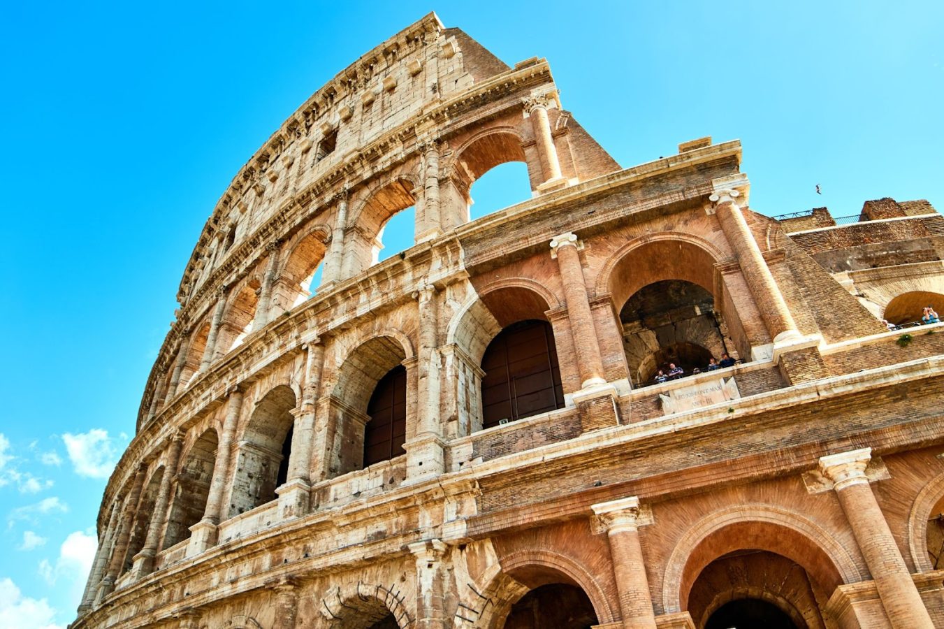 Closeup, upward view of the colosseum in Rome, Italy - the destination to travel to for Engineering and Architecture majors.