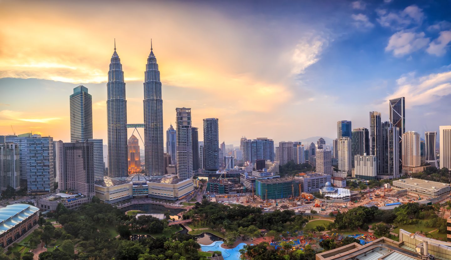 City skyline view of Kuala Lumpur at twilight in Malaysia - an affordable student travel destination.