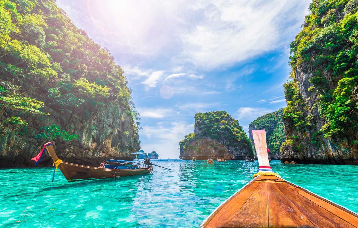 View of the bright blue waters of Loh Samah Bay, Phi Phi island, in Thailand from a boat. Thailand is a great affordable student travel destination from India.