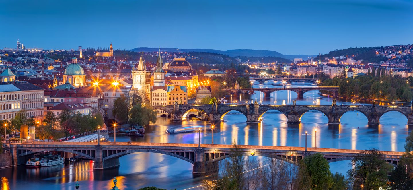 Prague, Czech Republic bridges panorama with historic Charles Bridge and Vltava river at night