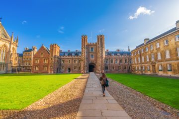 A university student walks on a path outside Cambridge University while taking a semester abroad.